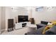 Finished basement with a comfortable seating area and entertainment center at 1007 N Ogden St, Denver, CO 80218