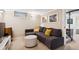 Basement living room with a sectional sofa and neutral color palette at 1007 N Ogden St, Denver, CO 80218
