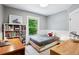 Cozy bedroom with a large window providing natural light and views of the outdoors at 1007 N Ogden St, Denver, CO 80218
