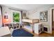 Cozy bedroom with bunk beds, a plush blue rug, and natural light at 1007 N Ogden St, Denver, CO 80218