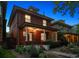 Charming brick home with a welcoming front porch, beautifully landscaped yard, and classic architectural details at 1007 N Ogden St, Denver, CO 80218