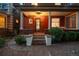 Inviting front porch with classic columns, detailed door, and swing, enhancing curb appeal at 1007 N Ogden St, Denver, CO 80218