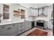 Modern kitchen with gray cabinets, stainless steel appliances, and a bright, open layout at 1007 N Ogden St, Denver, CO 80218