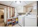 Basement laundry area with games, stairs and washer and dryer at 1007 N Ogden St, Denver, CO 80218