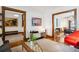 Charming living room featuring hardwood floors, a vintage record player, and decorative art at 1007 N Ogden St, Denver, CO 80218