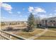 Balcony view showcasing the property's yard, landscaping, and neighborhood at 5350 S Jay Cir # 4A, Littleton, CO 80123