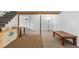 Large basement with stairs, neutral carpet, and versatile space for recreation or storage at 8600 S Warhawk Rd, Conifer, CO 80433