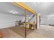 Spacious basement with exposed beams, stairs, and potential for flexible living space at 8600 S Warhawk Rd, Conifer, CO 80433