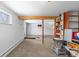Finished basement featuring neutral carpet, white walls, exposed beams, and ample open space at 8600 S Warhawk Rd, Conifer, CO 80433