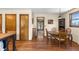 Dining room with wood floors and natural light at 8600 S Warhawk Rd, Conifer, CO 80433