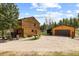 Exterior of the home, garage, and parking area at 8600 S Warhawk Rd, Conifer, CO 80433