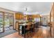 Kitchen with stainless steel appliances, a large center island and wood cabinets at 8600 S Warhawk Rd, Conifer, CO 80433