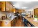 Charming kitchen featuring wood cabinets, stainless steel appliances, and a butcher block island at 8600 S Warhawk Rd, Conifer, CO 80433