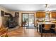 Bright kitchen featuring a stone fireplace and access to the outdoors at 8600 S Warhawk Rd, Conifer, CO 80433