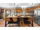 Kitchen with a large center island and stainless steel appliances at 8600 S Warhawk Rd, Conifer, CO 80433