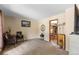 Spacious living room with comfortable seating, neutral walls and soft carpet at 8600 S Warhawk Rd, Conifer, CO 80433