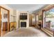 Inviting living room boasts fireplace, large windows, and decorative wall art at 8600 S Warhawk Rd, Conifer, CO 80433