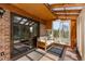 Bright sunroom has skylights, comfortable seating, and access to the outdoors at 8600 S Warhawk Rd, Conifer, CO 80433