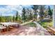 Enjoy this large outdoor deck with mountain views, a grill, and convenient access to the backyard at 11348 Ranch Elsie Rd, Golden, CO 80403