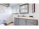 Updated bathroom with gray vanity, ample storage, and modern fixtures at 11348 Ranch Elsie Rd, Golden, CO 80403