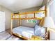 Rustic bedroom featuring a cozy, full-size log bunk bed perfect for or guests at 11348 Ranch Elsie Rd, Golden, CO 80403