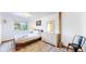Cozy bedroom with wood accents, natural light, and sliding barn door feature at 11348 Ranch Elsie Rd, Golden, CO 80403