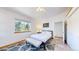 Bright bedroom featuring a queen bed, and bright, natural lighting at 11348 Ranch Elsie Rd, Golden, CO 80403