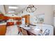 Dining area featuring ample natural light, a modern chandelier, and easy access to the kitchen at 11348 Ranch Elsie Rd, Golden, CO 80403