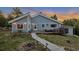 Charming home featuring a welcoming front deck and beautifully landscaped yard with mountain views at 11348 Ranch Elsie Rd, Golden, CO 80403