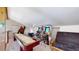 Game room boasts shuffleboard table, arcade games and comfortable futon at 11348 Ranch Elsie Rd, Golden, CO 80403
