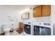 Bright laundry room featuring new, front-loading washer and dryer at 11348 Ranch Elsie Rd, Golden, CO 80403
