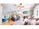 Bright living room with hardwood floors, vaulted ceiling, comfortable seating, and natural light at 11348 Ranch Elsie Rd, Golden, CO 80403
