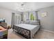 Bedroom with gray walls, ceiling fan and metal bed frame at 3226 W Girard Ave # D, Englewood, CO 80110