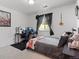 Comfortable bedroom with desk area, neutral walls, and carpet at 3226 W Girard Ave # D, Englewood, CO 80110