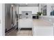 Kitchen with stainless steel appliances and white cabinets at 3226 W Girard Ave # D, Englewood, CO 80110