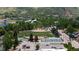 Scenic aerial view of a baseball and tennis field surrounded by green space and lush mountains at 801 8Th St, Golden, CO 80401