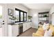 Entertainment area with a bar, cabinetry, beverage fridge, mountain views, and stylish decor at 801 8Th St, Golden, CO 80401