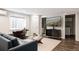 Finished basement with a sofa, tv, workspace, and bathroom access at 801 8Th St, Golden, CO 80401