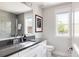 Modern bathroom with a single sink vanity and a tiled shower at 801 8Th St, Golden, CO 80401