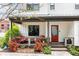 Charming front porch with stylish seating, vibrant landscaping, and a welcoming red front door at 801 8Th St, Golden, CO 80401