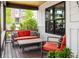 Cozy front porch featuring comfortable outdoor seating and a wooden table, perfect for relaxing at 801 8Th St, Golden, CO 80401