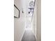 Bright hallway with carpet, white walls, modern artwork, and a decorative chandelier at 801 8Th St, Golden, CO 80401