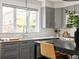 Kitchen sink and gray cabinets with subway tile backsplash and quartz countertops at 801 8Th St, Golden, CO 80401