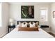 Comfortable main bedroom featuring a pine cone wall art print and plush bedding at 801 8Th St, Golden, CO 80401