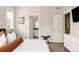Bright main bedroom featuring a modern dresser, stool, and view of the bathroom at 801 8Th St, Golden, CO 80401