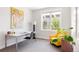 Bright office space featuring a desk, armchair, and large window at 801 8Th St, Golden, CO 80401