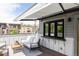Cozy outdoor deck featuring comfortable seating with a retractable awning and mountain view at 801 8Th St, Golden, CO 80401