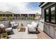 Inviting deck with comfortable outdoor seating, beautiful mountain views, and stylish wooden flooring at 801 8Th St, Golden, CO 80401
