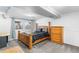 Finished basement bedroom with carpeted floors and wood furniture at 8010 W Chestnut Dr, Littleton, CO 80128