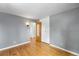 Simple bedroom with hardwood floors and gray walls at 8010 W Chestnut Dr, Littleton, CO 80128